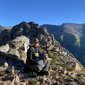 amy edgar on a mountain with her dog
