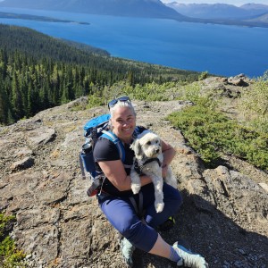 lisa walker with her dog on a hike