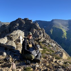 amy edgar on a mountain with her dog